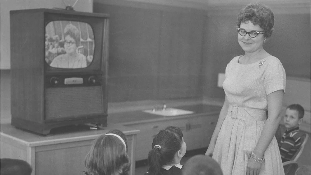 1950s teacher showing her students a television program